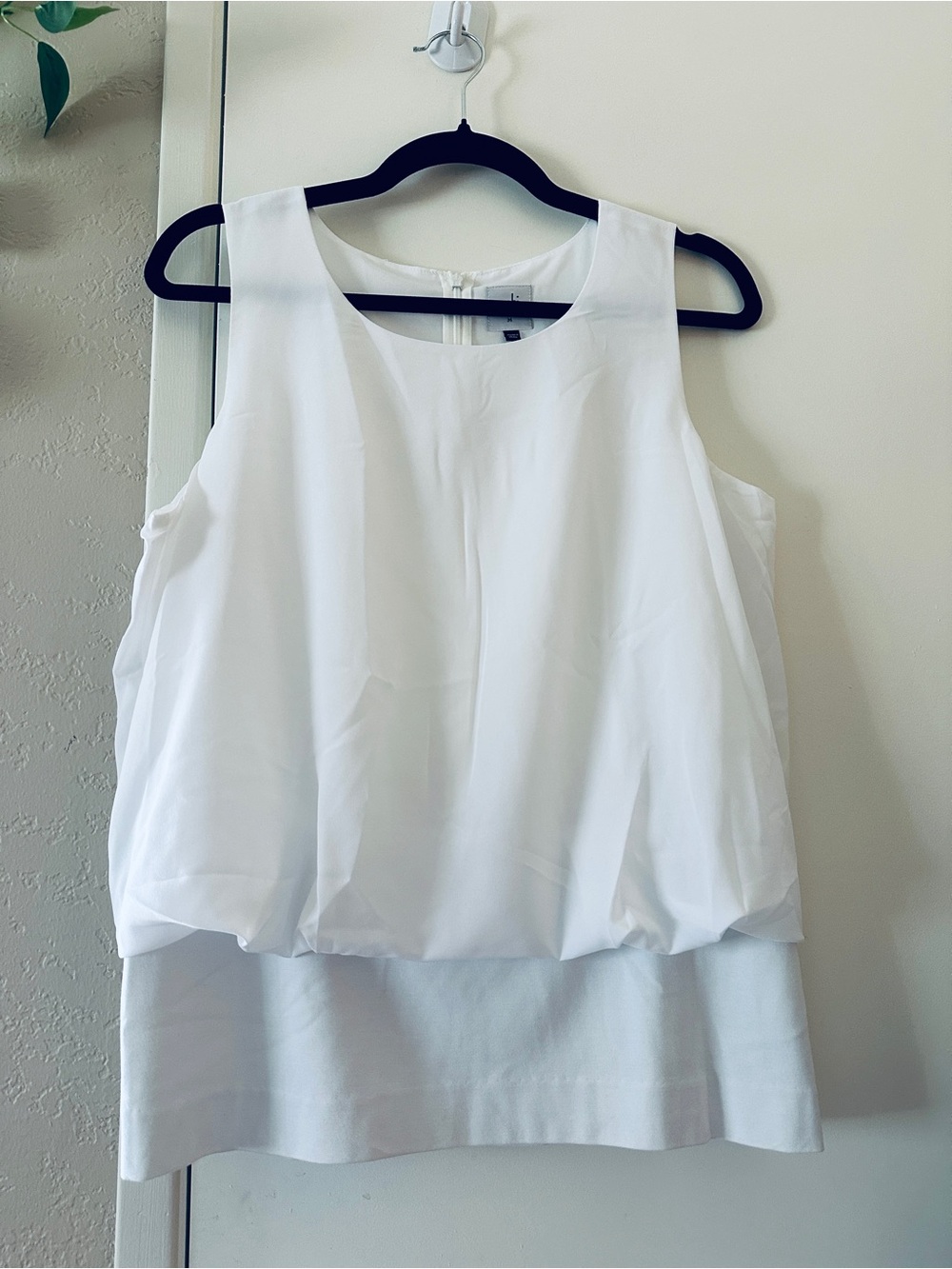 CAbi White Sleeveless Blouse- size Medium- Draped Bellowed Hem NWOT